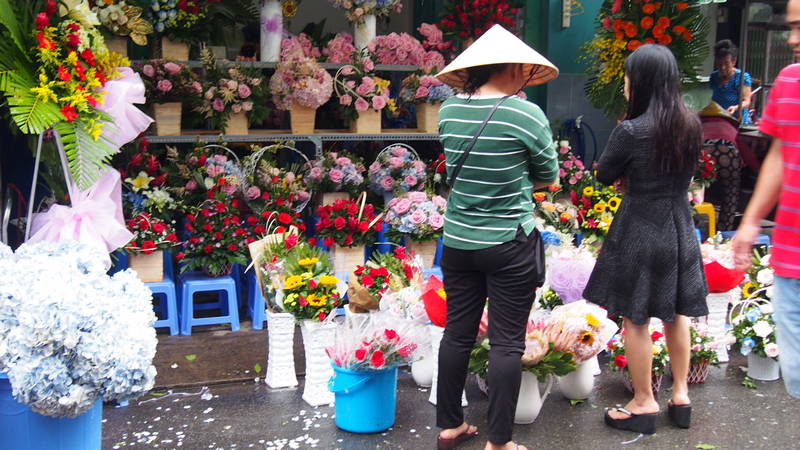 Cidade de Ho Chi Minh em Vietnã - Mercado de flores vietnamitas